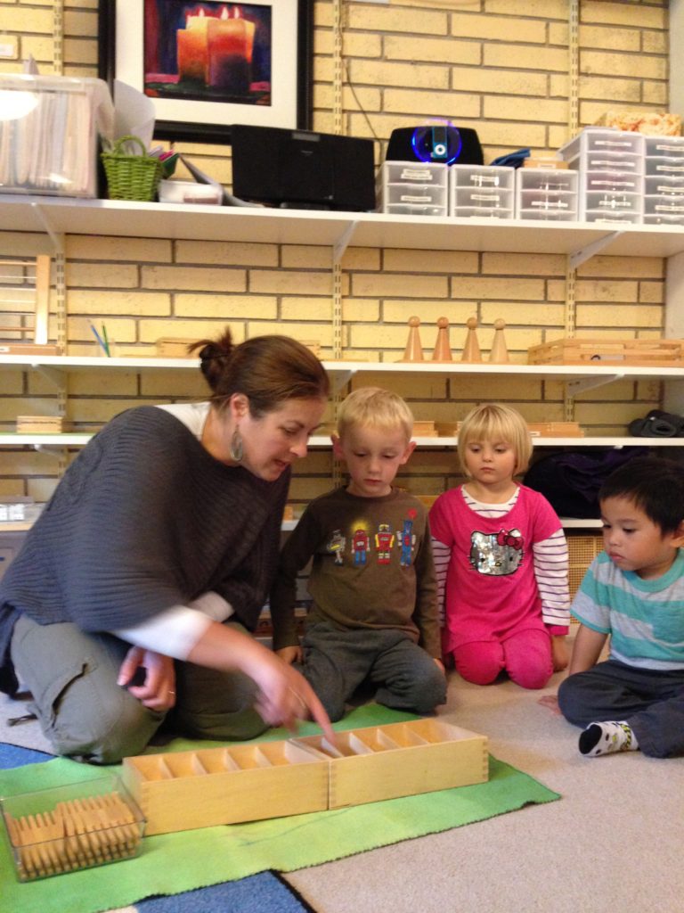 Children working in a Montessori classroom